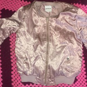 A Pink Silk Bomber Jacket With All Gold Zipper